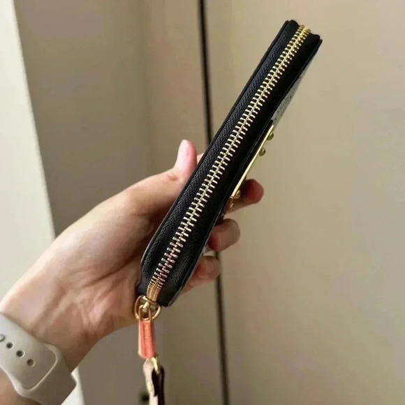 Michael Kors Black Wristlet with Gold Accents - Picture 4 of 14